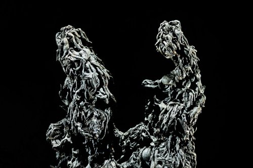 Mont Fuji lava tube (Mont Fuji, Japon) - Détail du sommet de deux stalagmites de lave (formées par un empilement de petits boudins de lave tombés du plafond)  (SP-19-0384)